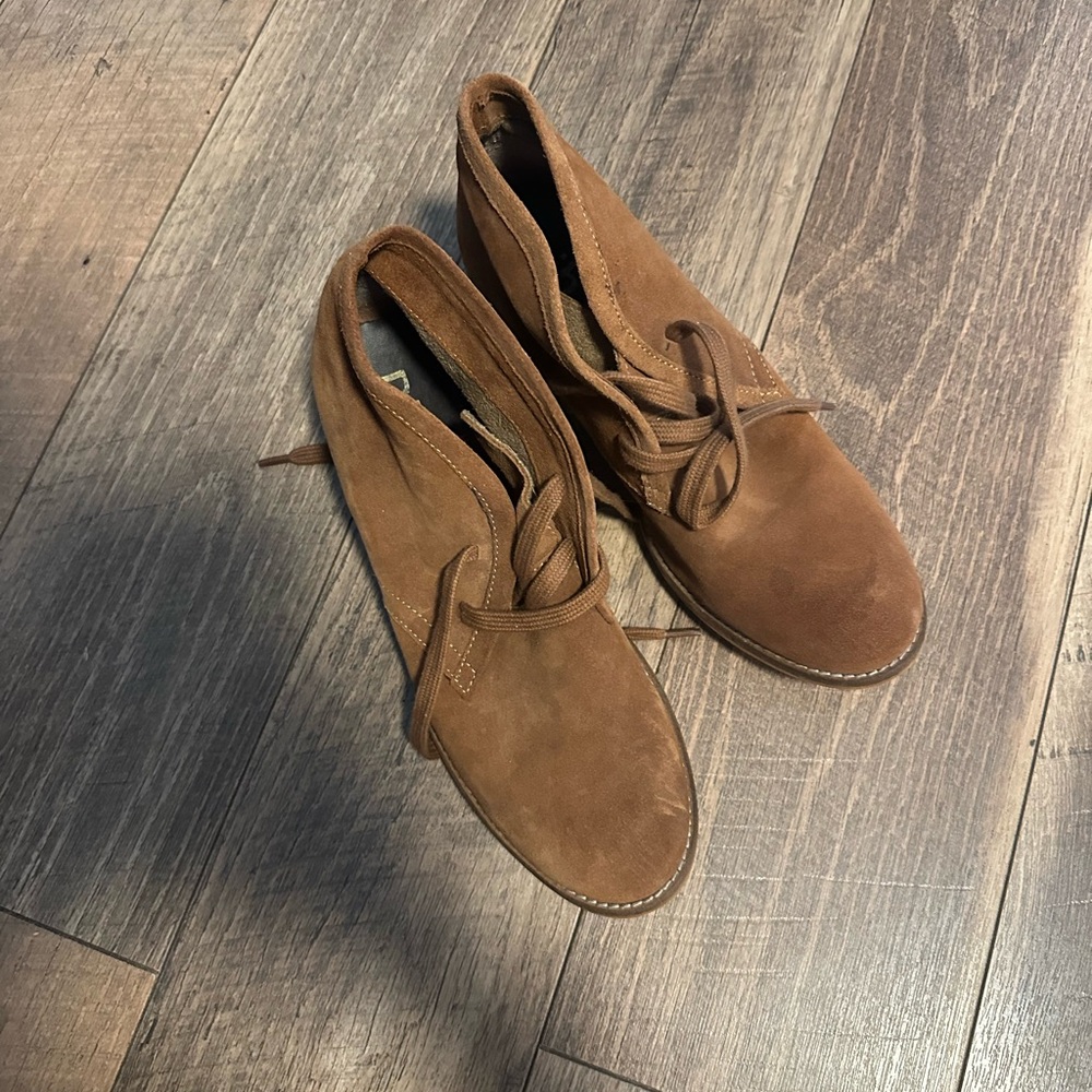 Brown leather boots.